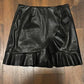 Size S - Black vegan leather skirt with asymmetrical ruffle trim