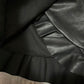 Size S - Black vegan leather skirt with asymmetrical ruffle trim