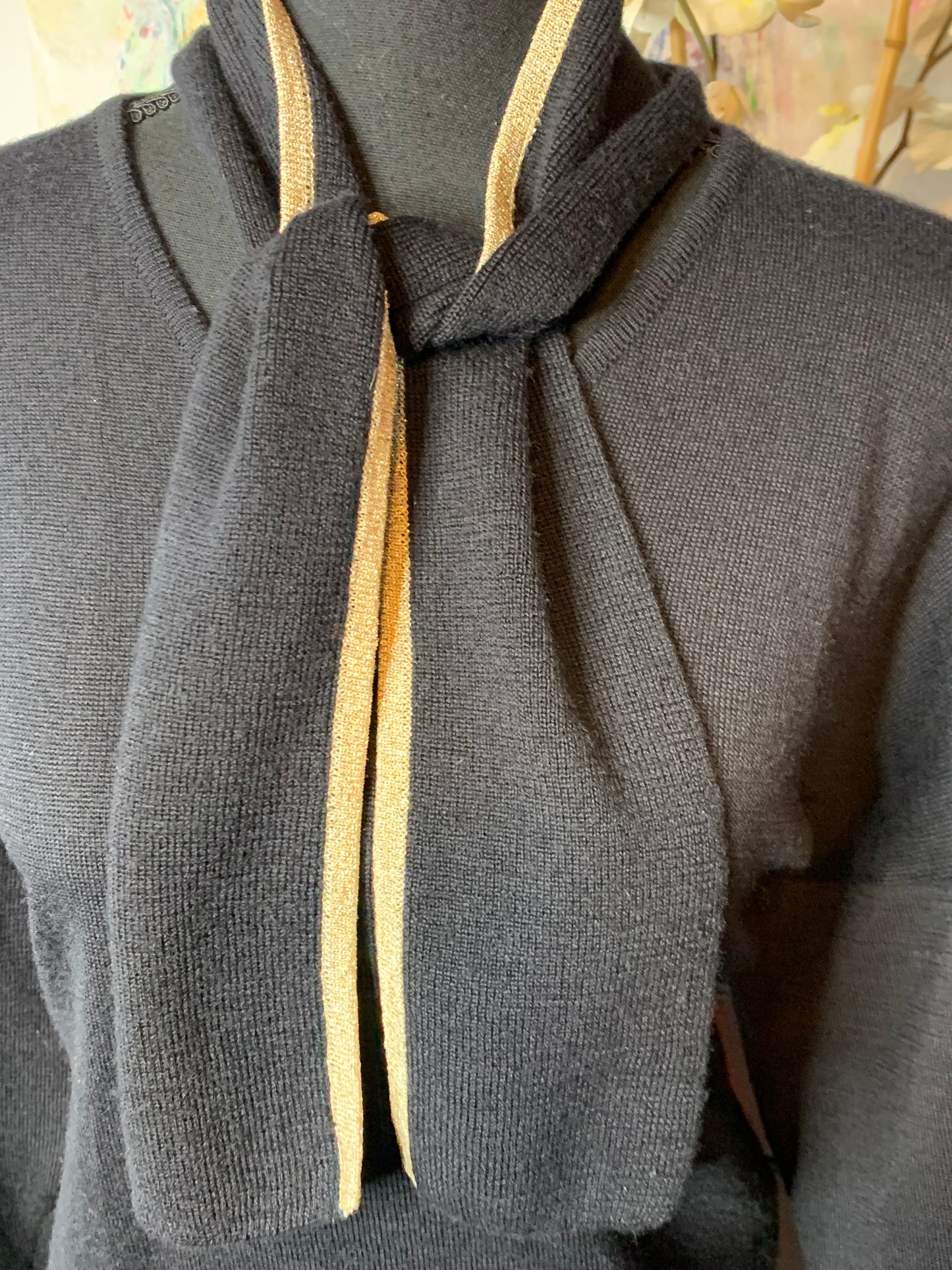 Size a medium Black and gold sweater