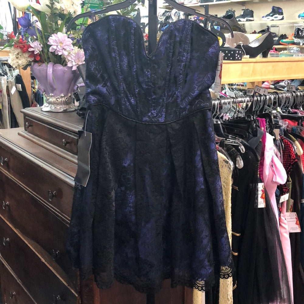 NWT size small. Purple with black lace overlay