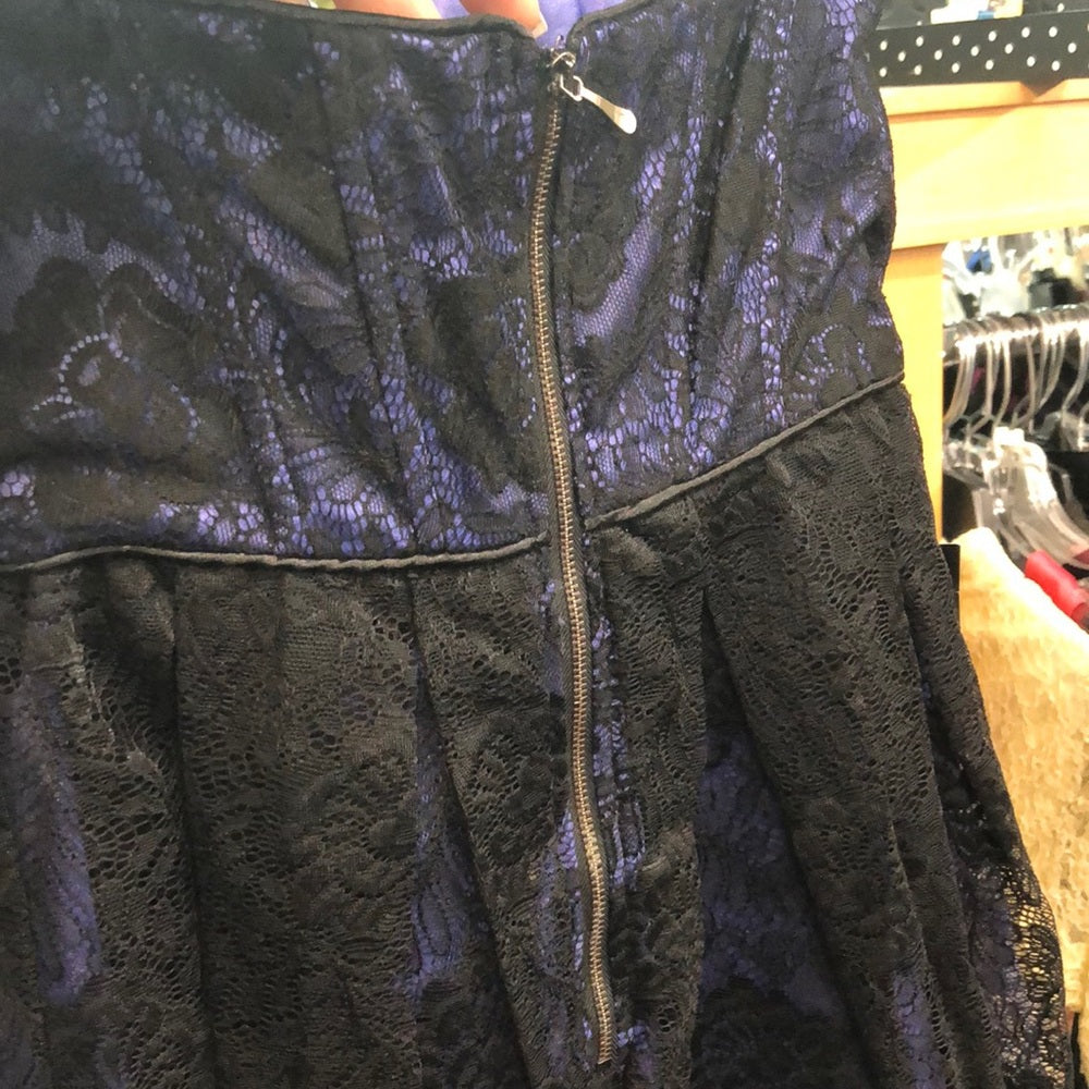 NWT size small. Purple with black lace overlay